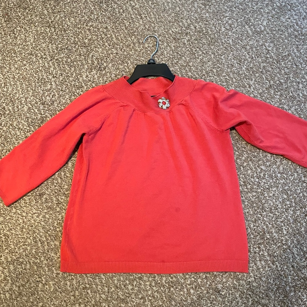 Requirements orange sweater with brooch